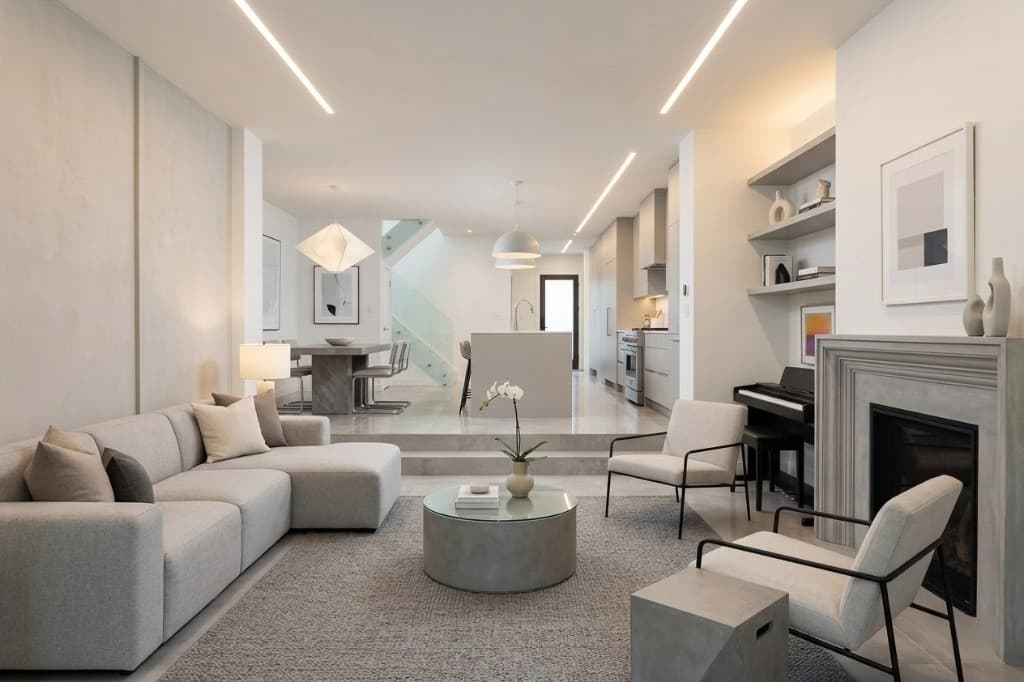 Open-concept renovated home with modern living room, dining area, and kitchen